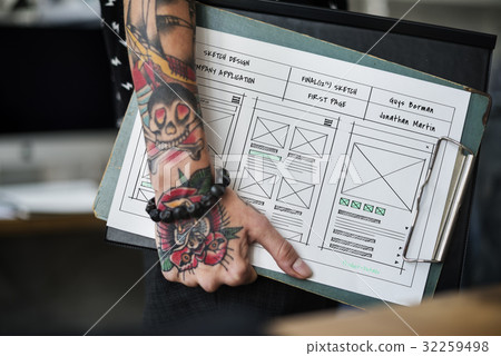 Tattoo hand hold a website design layout board Tattoo hand hold a website design layout board 32259498