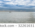 Fishing boat in the plan sea with cloudy sky 32261631