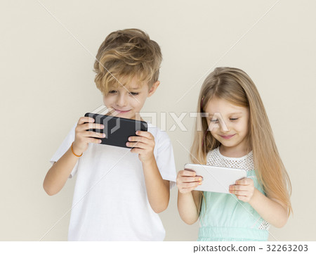 Young Kids Playing Mobile Phone Young Kids Playing Mobile Phone 32263203