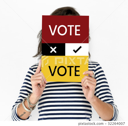 Woman hold vote card cover her face 32264007