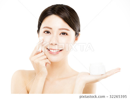 young woman showing beauty product on hand young woman showing beauty product on hand 32265395