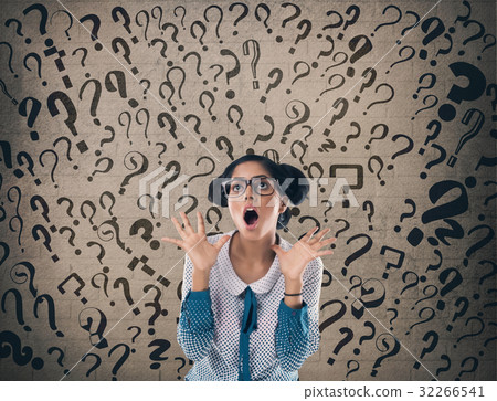 Shocked businessman in front of wall Shocked businessman in front of wall 32266541