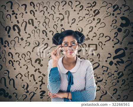 Shocked businessman in front of wall Shocked businessman in front of wall 32266561