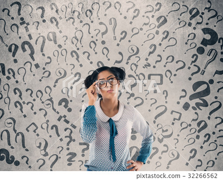 Shocked businessman in front of wall 32266562