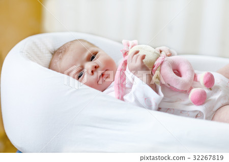 Cute baby girl playing with plush animal toy Cute baby girl playing with plush animal toy 32267819