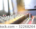Blur the audio mixer in the recording room. 32268264