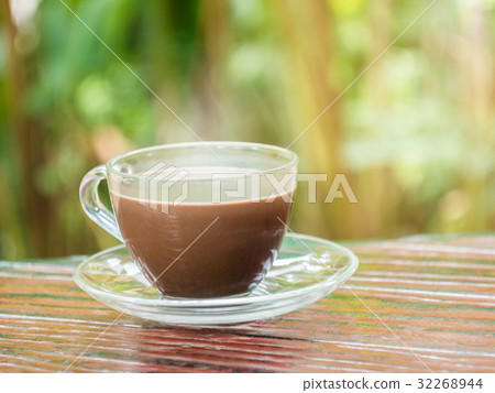 Hot cocoa in cup with smoke and warm light Hot cocoa in cup with smoke and warm light 32268944