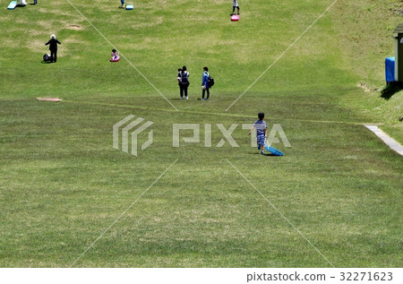 Children playing sledge at summer highland 32271623
