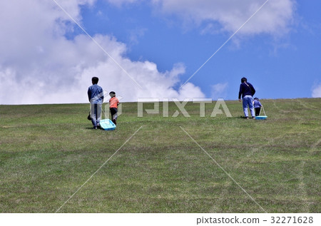 Children playing sledge at summer highland 32271628