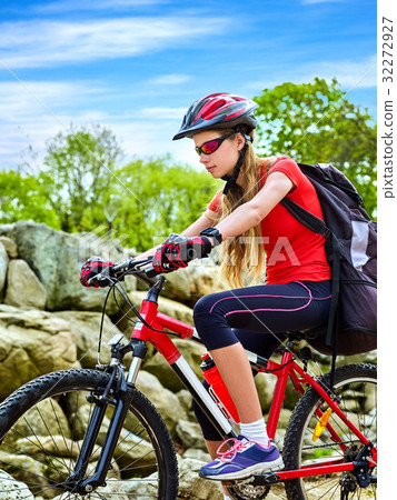 Woman traveling bicycle summer park. Early morning 32272927