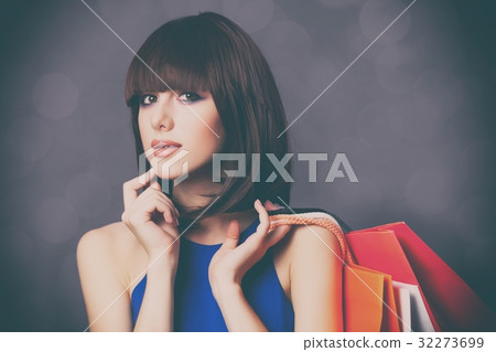 woman with colorful shopping bags 32273699