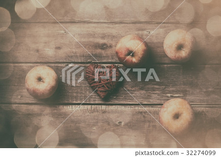 apples and heart shaped toy 32274099