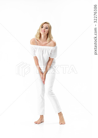 Beautiful smiling blond woman in white blouse and Beautiful smiling blond woman in white blouse and 32276386