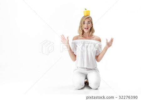 Beautiful fun blond woman in white blouse holding Beautiful fun blond woman in white blouse holding 32276390