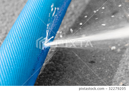 water leaking from hole in a hose 32279205