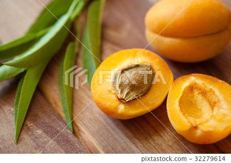 Ripe apricots on wooden background Ripe apricots on wooden background 32279614