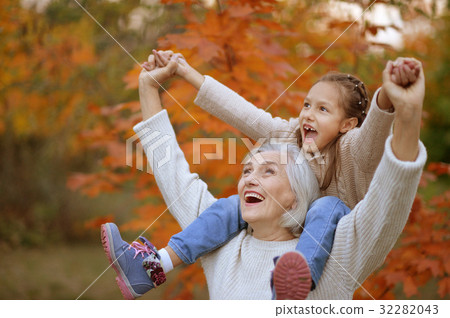 grandmother and grand daughter having fun 32282043