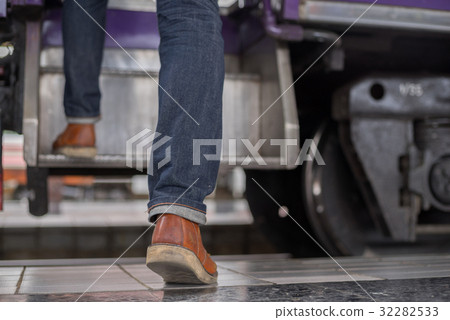 man traveler with backpacker at trainstation 32282533