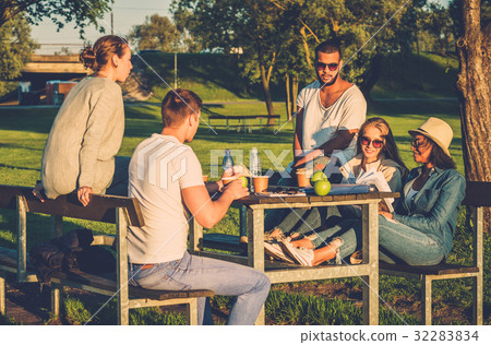 Multi-ethnic group of friends drinking coffee and Multi-ethnic group of friends drinking coffee and 32283834