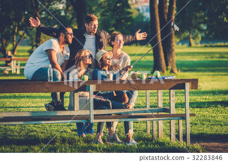 Multi-ethnic group of friends taking a selfie with Multi-ethnic group of friends taking a selfie with 32283846