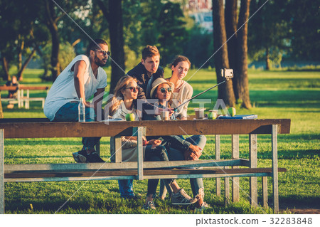 Multi-ethnic group of friends taking a selfie with Multi-ethnic group of friends taking a selfie with 32283848