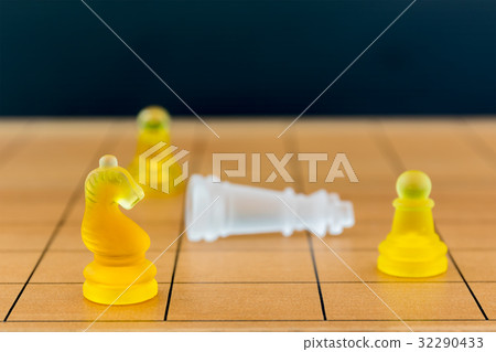 Chess glass on a wood chessboard 32290433