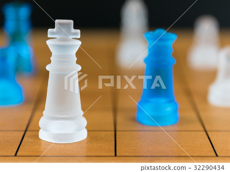 Chess glass on a wood chessboard 32290434