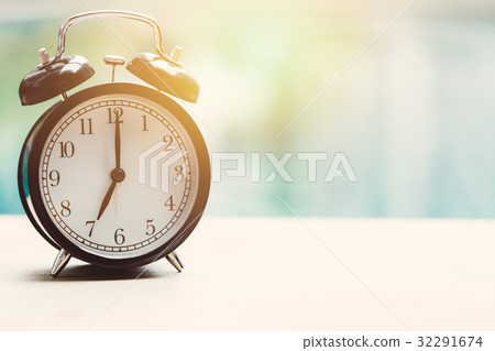 7 o'clock retro clock at the swimming pool  7 o'clock retro clock at the swimming pool  32291674