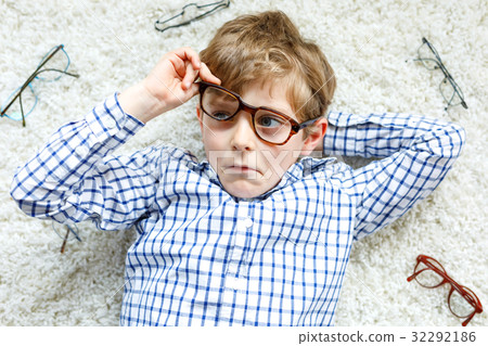 Close-up portrait of little blond kid boy with Close-up portrait of little blond kid boy with 32292186