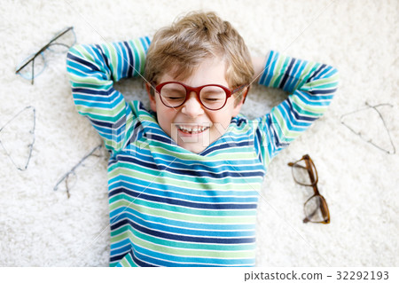 Close-up portrait of little blond kid boy with 32292193