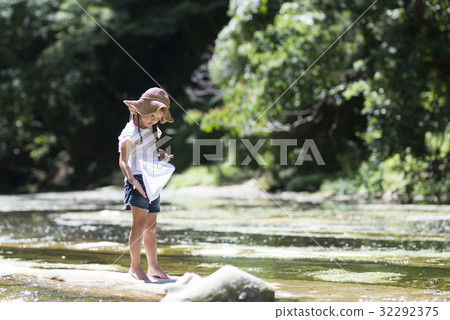Girls playing on the river Girls playing on the river 32292375