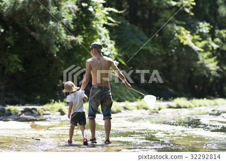Parents and children playing in the river Parents and children playing in the river 32292814