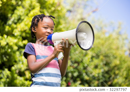 Boy using a megaphone Boy using a megaphone 32297797