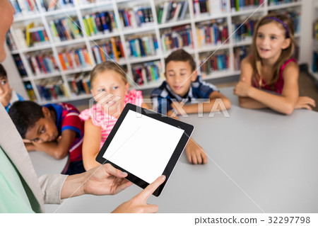 Close up view of a tablet hold by a teacher Close up view of a tablet hold by a teacher 32297798