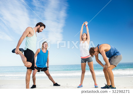 People stretching on the beach 32298271
