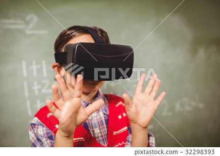 Boy using a virtual reality device Boy using a virtual reality device 32298393
