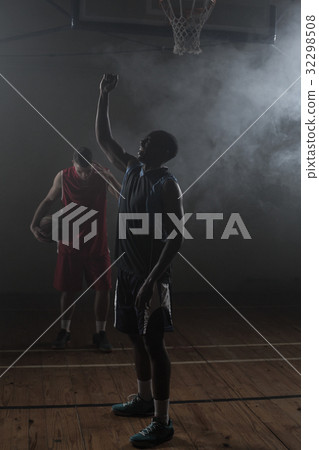 Victorious basketball player raising his arms up Victorious basketball player raising his arms up 32298508