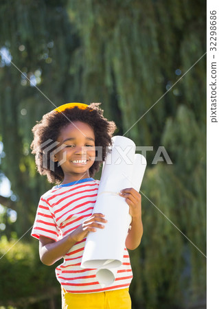 Smiling boy holding plan Smiling boy holding plan 32298686
