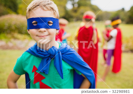 Portrait of young boy smiling and wearing a superhero dress Portrait of young boy smiling and wearing a superhero dress 32298981