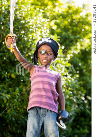 Boy is dressing up as a pirate Boy is dressing up as a pirate 32299141