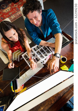 Colleagues using a graphic pad Colleagues using a graphic pad 32299230