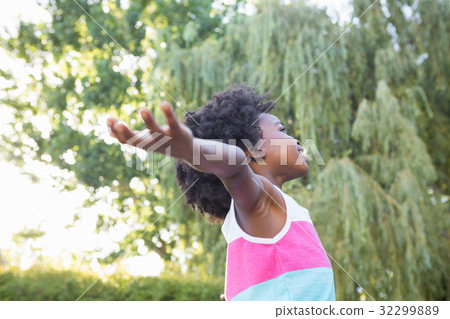 Child with arms outstretched 32299889