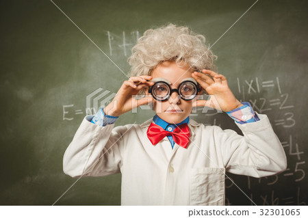 Boy standing in front of blackboard Boy standing in front of blackboard 32301065