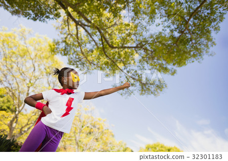 Cute girl pretending to be a superhero Cute girl pretending to be a superhero 32301183
