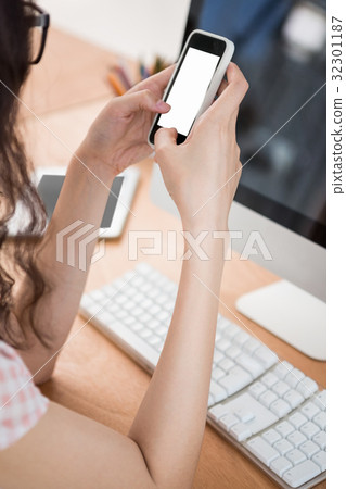 A business woman is using her phone A business woman is using her phone 32301187