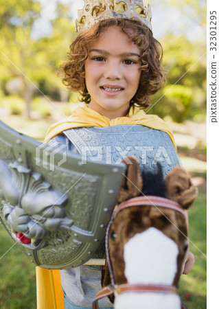 Portrait of a cute boy pretending to be a superhero Portrait of a cute boy pretending to be a superhero 32301295