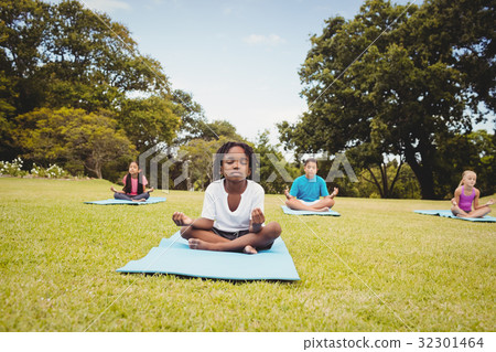 Group of children doing yoga Group of children doing yoga 32301464
