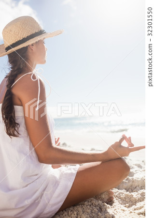 Rear view of woman performing yoga 32301550