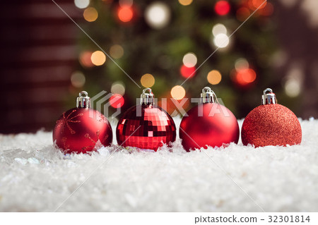 Composite image of Christmas baubles lined up 32301814