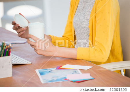 A woman is opening a box A woman is opening a box 32301893